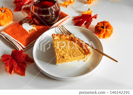 Pumpkin Pie Slice with Autumn Drink Pumpkin Pie Slice with Autumn Drink 140142291