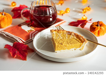 Pumpkin Pie Slice with Autumn Drink Pumpkin Pie Slice with Autumn Drink 140142293