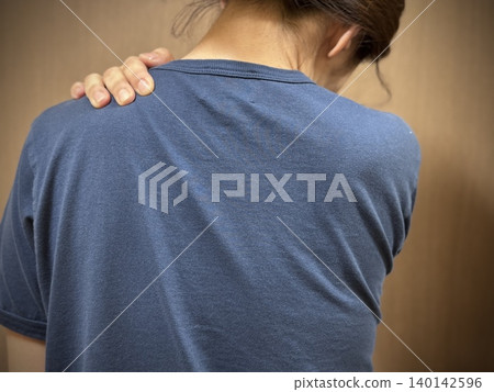 Japanese woman with stiff neck Japanese woman with stiff neck 140142596