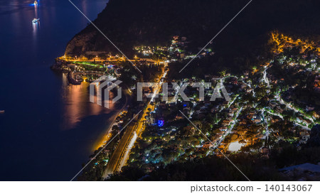 Day to night timelapse view of the Mediterranean coastline of the town of Eze village on the French Riviera Day to night timelapse view of the Mediterranean coastline of the town of Eze village on the French Riviera 140143067