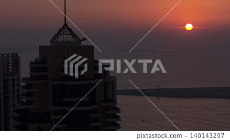 Dubai marina sunset at the sea from top aerial timelapse Dubai marina sunset at the sea from top aerial timelapse 140143297