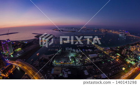 Aerial view from Dubai Marina panorama from day to night transition timelapse Aerial view from Dubai Marina panorama from day to night transition timelapse 140143298