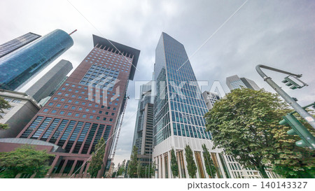 Hyperlapse looking up perspective at glass skyscrapers in Frankfurt's Innenstadt district. Germany Hyperlapse looking up perspective at glass skyscrapers in Frankfurt's Innenstadt district. Germany 140143327
