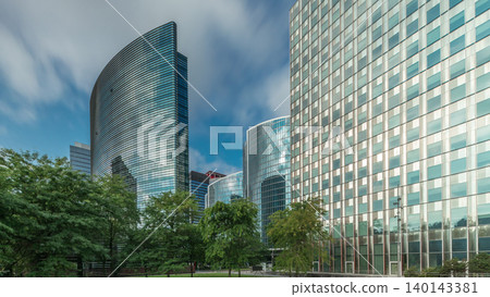 Timelapse panorama of modern office buildings. Glass skyscrapers with reflections and highlights Timelapse panorama of modern office buildings. Glass skyscrapers with reflections and highlights 140143381