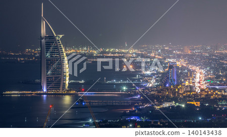 Aerial View of Jumeirah Beach and Dubai skyline with Burj Al Arab day to night timelapse, UAE 140143438