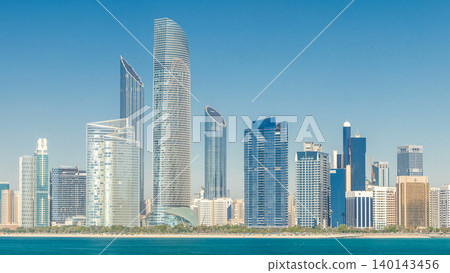 View of high skyscrapers on a corniche in Abu Dhabi stretching alongside the business center timelapse. 140143456