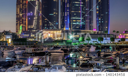Al Bateen marina Abu Dhabi day to night timelapse with modern skyscrapers on background Al Bateen marina Abu Dhabi day to night timelapse with modern skyscrapers on background 140143458