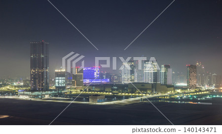 Buildings on Al Reem island in Abu Dhabi night timelapse from above. Buildings on Al Reem island in Abu Dhabi night timelapse from above. 140143471