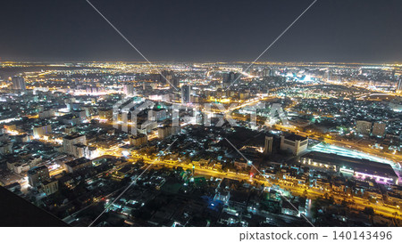Cityscape of Ajman from rooftop night aerial timelapse 140143496