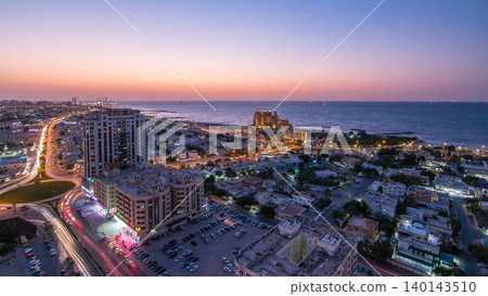 Cityscape of Ajman and Sharjah day to night timelapse from top Cityscape of Ajman and Sharjah day to night timelapse from top 140143510