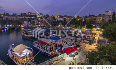 Aerial view of yacht harbor and red house roofs in "Old town" day to night timelapse Antalya, Turkey. Aerial view of yacht harbor and red house roofs in "Old town" day to night timelapse Antalya, Turkey. 140143530