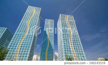 Modern towers of residential complex near Ishim River timelapse hyperlapse in Astana Modern towers of residential complex near Ishim River timelapse hyperlapse in Astana 140143534