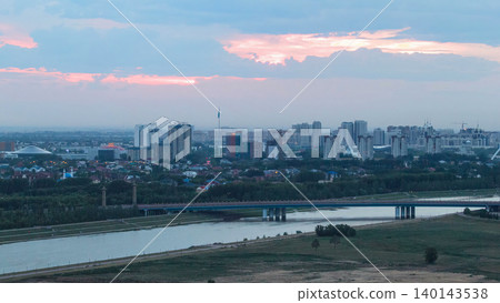 Sunset timelapse above the Bridge with the transport and clouds on the background. Central Asia, Kazakhstan, Astana Sunset timelapse above the Bridge with the transport and clouds on the background. Central Asia, Kazakhstan, Astana 140143538