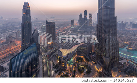 Panoramic skyline view of Dubai downtown with mall, fountains and Burj Khalifa aerial night to day timelapse Panoramic skyline view of Dubai downtown with mall, fountains and Burj Khalifa aerial night to day timelapse 140143557