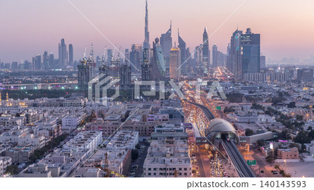 Dubai skyline after sunset with beautiful city center lights and Sheikh Zayed road traffic timelapse, Dubai, United Arab Emirates 140143593