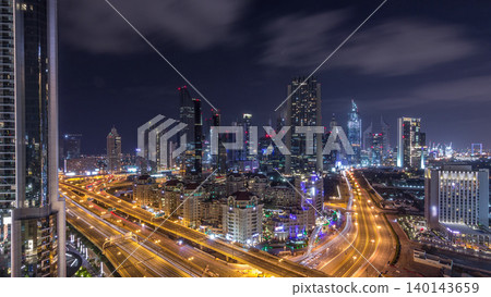 Aerial view on downtown and financial district in Dubai during all night timelapse, United Arab Emirates with skyscrapers and highways. Aerial view on downtown and financial district in Dubai during all night timelapse, United Arab Emirates with skyscrapers and highways. 140143659