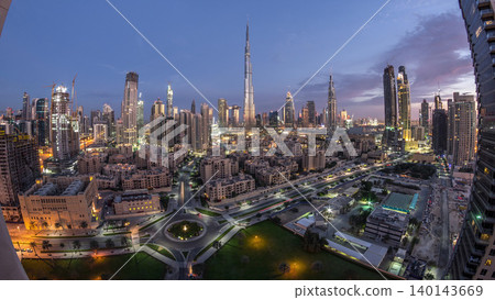 Dubai Downtown skyline night to day timelapse with Burj Khalifa and other towers panoramic view from the top in Dubai Dubai Downtown skyline night to day timelapse with Burj Khalifa and other towers panoramic view from the top in Dubai 140143669