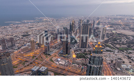 Downtown of Dubai night timelapse before sunrise. Aerial view with towers and skyscrapers Downtown of Dubai night timelapse before sunrise. Aerial view with towers and skyscrapers 140143672
