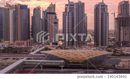 Aerial top view to Sheikh Zayed road near Dubai Marina and JLT night to day timelapse, Dubai. 140143691