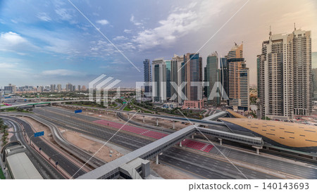 Aerial top view to Sheikh Zayed road near Dubai Marina and JLT timelapse, Dubai. Aerial top view to Sheikh Zayed road near Dubai Marina and JLT timelapse, Dubai. 140143693