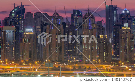 Dubai Marina skyscrapers and golf course day to night timelapse, Dubai, United Arab Emirates Dubai Marina skyscrapers and golf course day to night timelapse, Dubai, United Arab Emirates 140143707