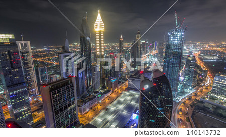 Skyline of the buildings of Sheikh Zayed Road and DIFC aerial night timelapse in Dubai, UAE. Skyline of the buildings of Sheikh Zayed Road and DIFC aerial night timelapse in Dubai, UAE. 140143732