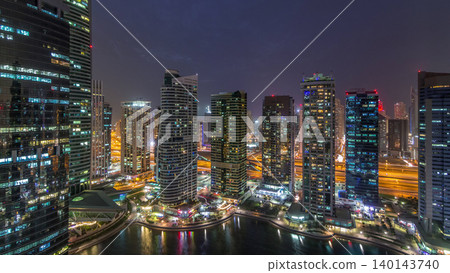 Residential and office buildings in Jumeirah lake towers district day to night timelapse in Dubai Residential and office buildings in Jumeirah lake towers district day to night timelapse in Dubai 140143740