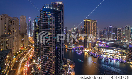 Evening illumination of Dubai Marina day to night aerial timelapse, UAE. Evening illumination of Dubai Marina day to night aerial timelapse, UAE. 140143776