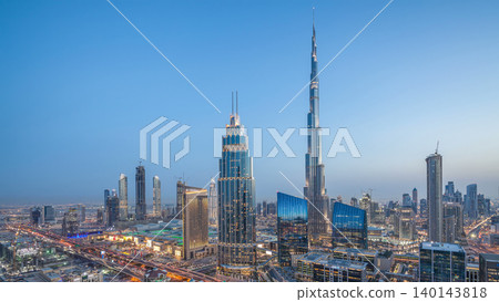 Dubai downtown skyline day to night timelapse with tallest building and Sheikh Zayed road traffic, UAE Dubai downtown skyline day to night timelapse with tallest building and Sheikh Zayed road traffic, UAE 140143818