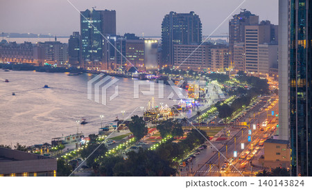 Dubai creek landscape day to night timelapse with boats and ship near waterfront Dubai creek landscape day to night timelapse with boats and ship near waterfront 140143824