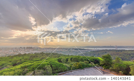 Panoramic sunrise view over Lisbon and Almada from a viewpoint in Monsanto morning timelapse. Panoramic sunrise view over Lisbon and Almada from a viewpoint in Monsanto morning timelapse. 140143841