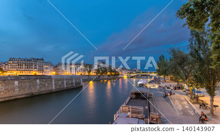 View to the Pont De La Tournelle on the River Seine day to night timelapse with waterfront. 140143907