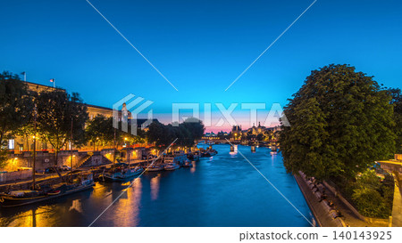 View to Pont des Arts in Paris after sunset day to night timelapse, France View to Pont des Arts in Paris after sunset day to night timelapse, France 140143925