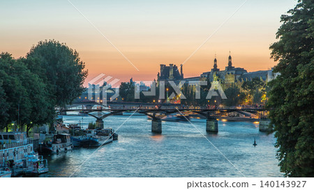 View to Pont des Arts in Paris after sunset day to night timelapse, France View to Pont des Arts in Paris after sunset day to night timelapse, France 140143927
