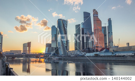 Sunset at Moscow City business center skyscrapers office buildings and luxury apartments timelapse hyperlapse. Sunset at Moscow City business center skyscrapers office buildings and luxury apartments timelapse hyperlapse. 140144002