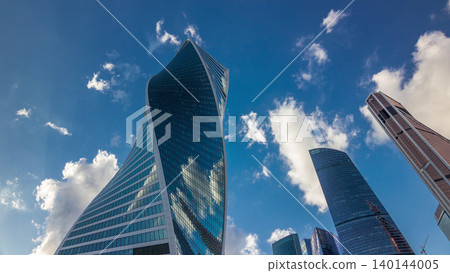 Moscow City business center skyscrapers office buildings looking up view timelapse hyperlapse. Moscow City business center skyscrapers office buildings looking up view timelapse hyperlapse. 140144005