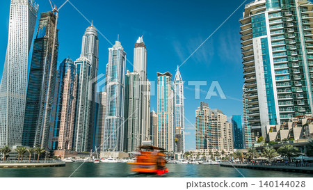 Dubai Marina towers in Dubai at day time timelapse 140144028