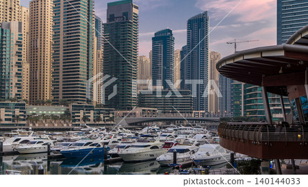 Dubai Marina at Blue hour night to day timelapse with yachts Dubai Marina at Blue hour night to day timelapse with yachts 140144033
