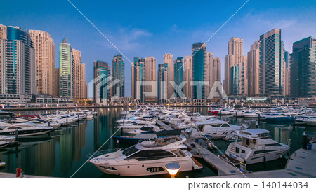 Dubai Marina at Blue hour night to day timelapse with yachts Dubai Marina at Blue hour night to day timelapse with yachts 140144034