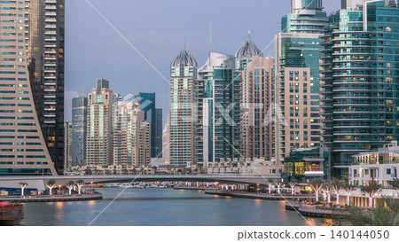 Dubai Marina towers and canal in Dubai day to night timelapse Dubai Marina towers and canal in Dubai day to night timelapse 140144050