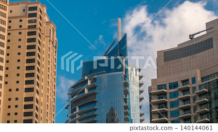 Morning view of Dubai Marina towers in Dubai timelapse Morning view of Dubai Marina towers in Dubai timelapse 140144061