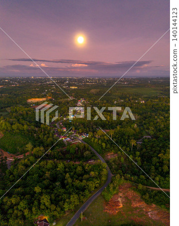 The natural beauty of Indonesia's long beaches with beautiful forests and seas at sunrise 140144123