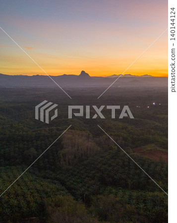 The natural beauty of Indonesia's long beaches with beautiful forests and seas at sunrise 140144124