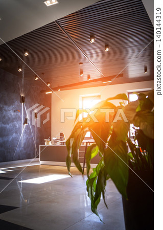 Office room with blank computer display,table,chair,cement floor,glass walls with night city view. Mixed media . 140144319