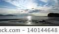 The sea quietly brings the day to an end. 140144648