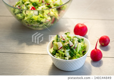 homemade vegetable salad on rustic wooden table background homemade vegetable salad on rustic wooden table background 140144849