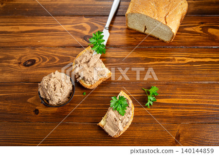 Homemade liver pate sandwiches on rustic wooden background Homemade liver pate sandwiches on rustic wooden background 140144859