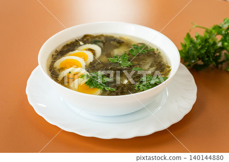 traditional green borscht with sorrel and eggs 140144880