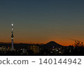 The silhouettes of Tokyo Skytree and Mount Fuji at dusk. 140144942
