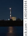 A fantastical night view with the crescent moon and Tokyo Skytree overlapping. 140144944